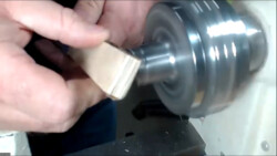 Sanding block created by gluing sandpaper to simple stick, by Scott Tague